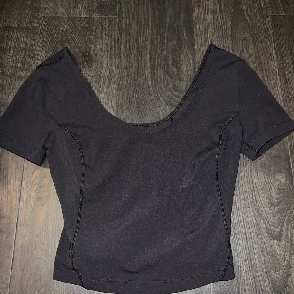 Lululemon black wide shoulder crop top. Size 4. Fits kind of tight.